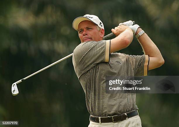 Simon Yates of Scotland plays his tee shot on the fifth hole during the first round of The Carlsberg Malaysian Open on February 17, 2005 at Saujana...