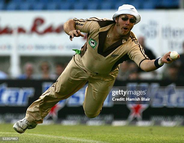 Craig McMillan of New Zealand dives but fails to complete a catch from Michael Clarke of Australia during the Twenty20 International Match between...