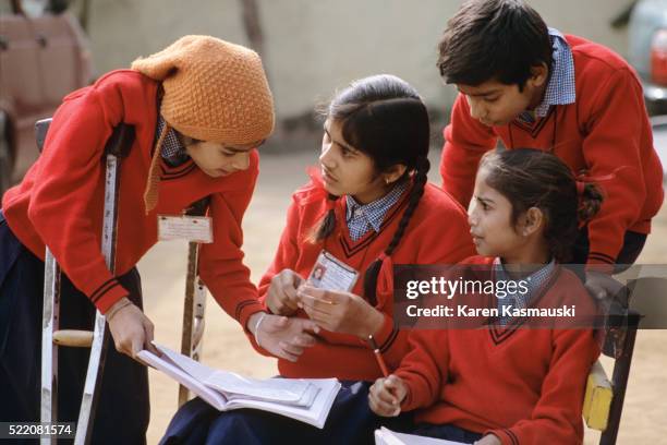 student with polio - indian crutch stock pictures, royalty-free photos & images