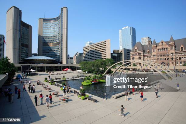 crowd enjoying sunshine in nathan phillips square - town hall square fotografías e imágenes de stock