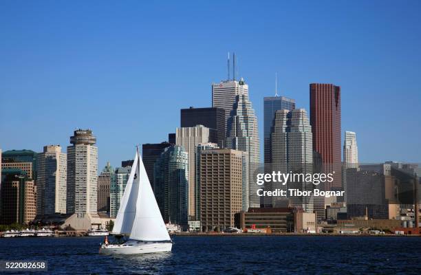 sailboat sailing by downtown toronto - lake ontario stock pictures, royalty-free photos & images