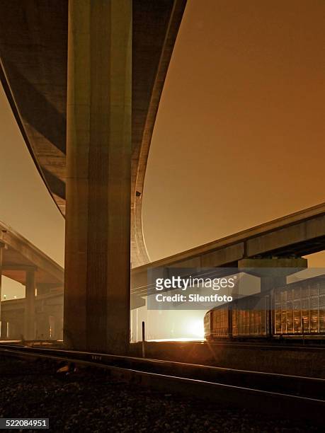 train a'comin' - train yard at night stock pictures, royalty-free photos & images