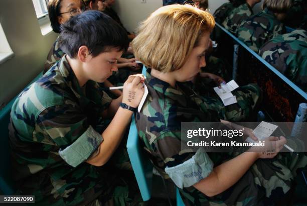 marine recruits filling out forms - parris island women stock pictures, royalty-free photos & images