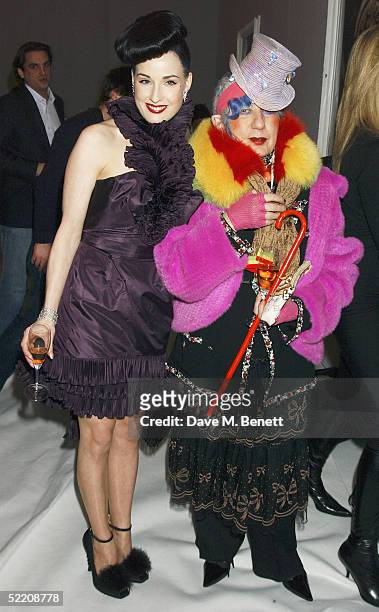 Burlesque dancer Dita Von Teese and designer Anna Piaggi attend the Moet & Chandon Fashion Tribute award at the biennial awards ceremony recognising...