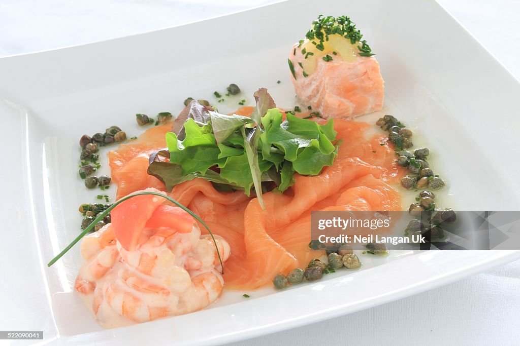 Plated smoked salmon and king prawn appetizer