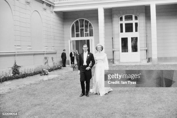 The royal wedding of Prince Michael of Kent and Baroness Christine von Reibnitz pose for pictures outside the British Embassy in Vienna after a civil...