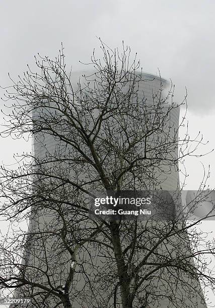 Gas emissions belch from a giant chimney of a power station on February 17, 2005 in Beijing, China. China, the world's second biggest greenhouse gas...