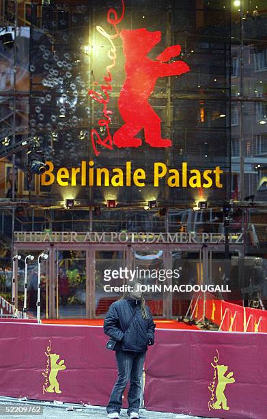 Lone fan, waiting to see the stars in "The Life Aquatic with Steve Zissou", claims a choice spot next to the Berlinale Palast's red carpet, over two...