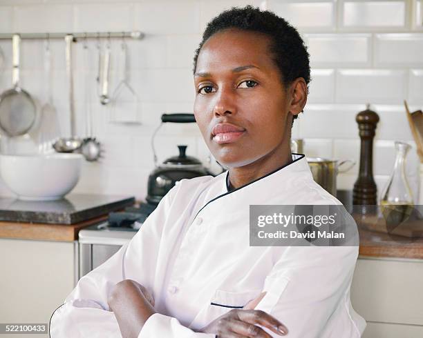proud portrait of a female chef - chef's whites stock-fotos und bilder