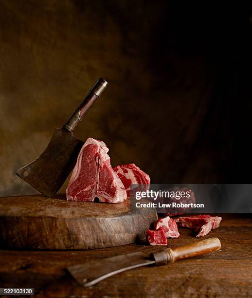 raw meat in a rustic and moody environment - naturaleza muerta fotografías e imágenes de stock