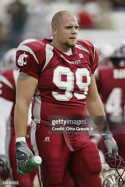 Defensive tackle Steve Cook of the Washington State University Cougars watches the game against the University of Oregon Ducks on October 9 2004 at...