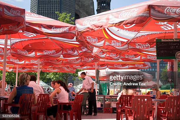 cafe with coca-cola umbrellas - berlin cafe stock pictures, royalty-free photos & images