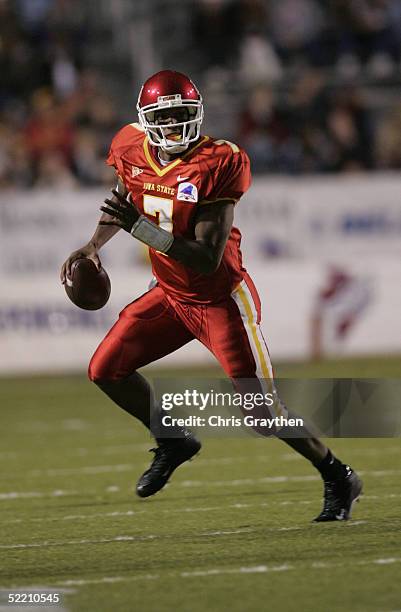 Quarterback Bret Meyer of the Iowa State University Cyclones scrambles with the ball against the Miami University of Ohio RedHawks during the...