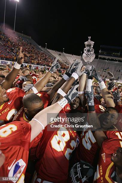 Wide receiver R.J. Sumrall of the Iowa State University Cyclones celebrates with his teammates after winning the Independence Bowl against the Miami...