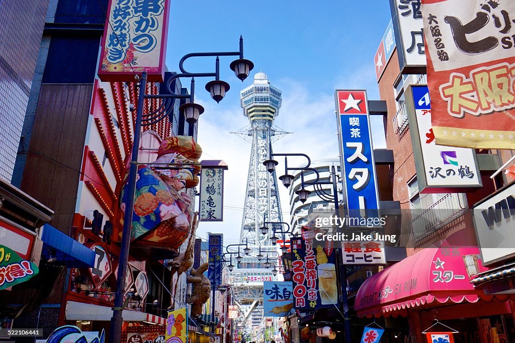 Color signs and Tsutenkaku Tower in south Osaka
