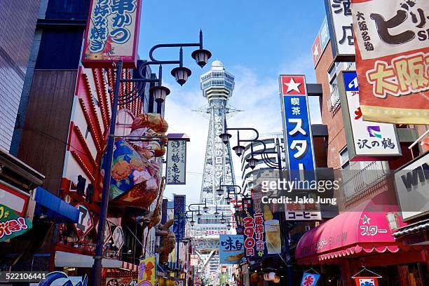color signs and tsutenkaku tower in south osaka - osaka prefecture stock pictures, royalty-free photos & images