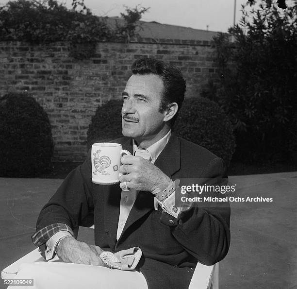 Actor Gilbert Roland poses during a portrait session at home in Los Angeles,CA.