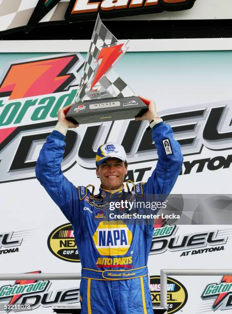 Michael Waltrip celebrates with the Gatorade Duel Trophy after winning the first Gatorade Duel race at the NASCAR Nextel Cup Daytona 500 February 17,...