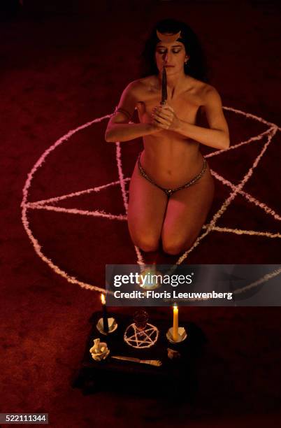 wiccan performing personal ritual - floris leeuwenberg stock pictures, royalty-free photos & images