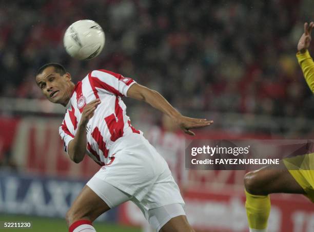 Olympiakos Piraeus' Rivaldo vies with an unidentified player of France's Sochaux during a UEFA Cup football match in Athens City 17 February 2005....