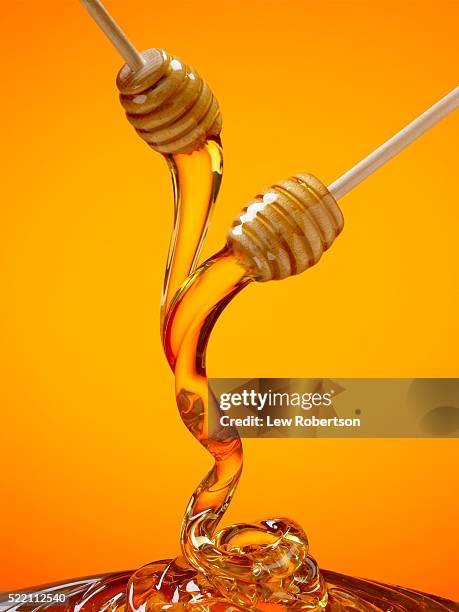 honey dipper - honey stockfoto's en -beelden