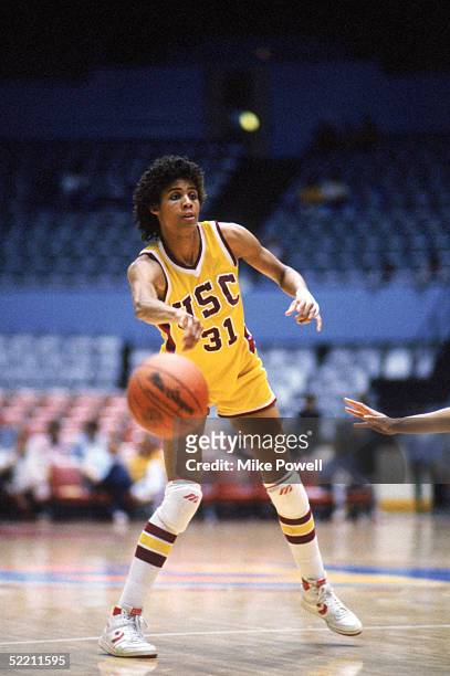Cheryl Miller of USC Trojans passes the ball during a women basketball game against the Stanford Cardinal in Palo Alto, California. Cheryl Miller's...