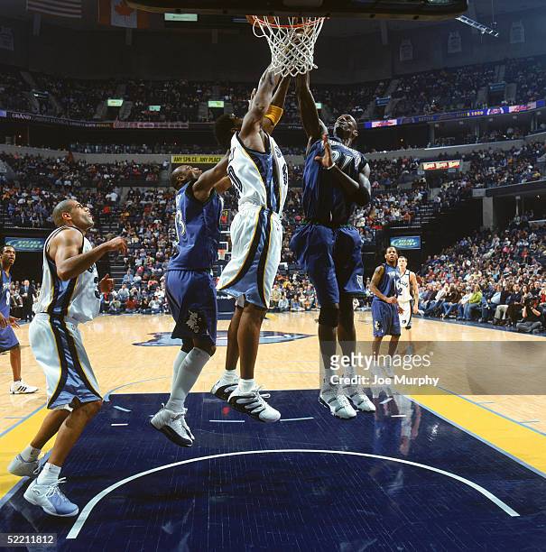 Kevin Garnett of the Minnesota Timberwolves goes to the basket against Ryan Humphrey of the Memphis Grizzlies during the game at FedExForum on...