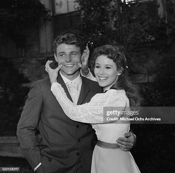 Actress Jill St. John poses with actor David Nelson on set in Los Angeles,CA.