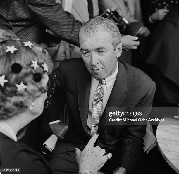 Actor James Stewart talks with Ambassador Perle Mesta during the Helen Hays party in Los Angeles,CA.