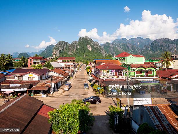 street in vang vieng, laos - vang vieng stock pictures, royalty-free photos & images