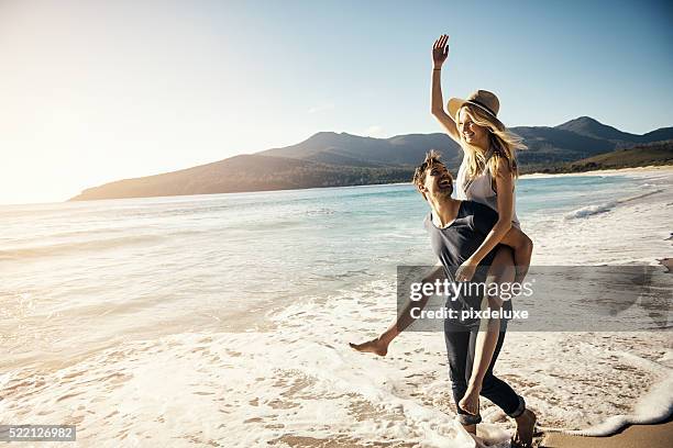 expressions of true love - young couple on beach stock pictures, royalty-free photos & images