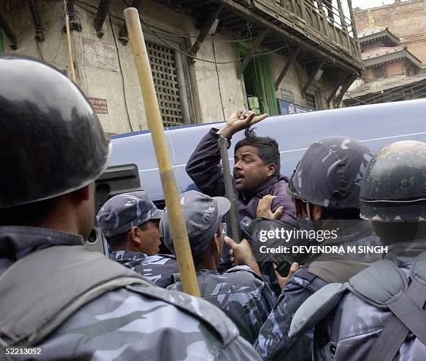 Protester , one of fifteen arrested, shouts anti-Monarch slogans during a protest marking the 54th National Democracy Day, in Kathmandu 18 February...