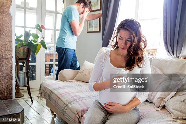pregnant couple having propblems - forced marriage stockfoto's en -beelden