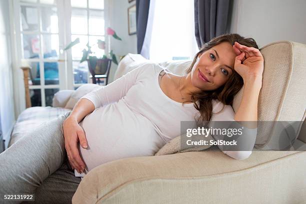 pregnant woman relaxing - hormone stock pictures, royalty-free photos & images