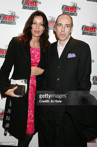 Mick Jones of The Clash arrives with an unidentified guest at The Shockwaves NME Awards 2005 at Hammersmith Palais on February 17, 2005 in London....