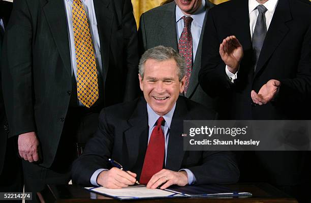 President George W. Bush smiles before a bill signing ceremony in the East Room at the White House February 18, 2005 in Washington, DC. Bush signed...