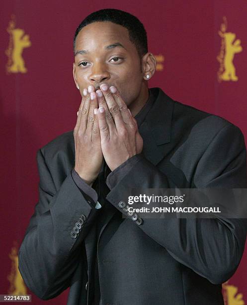 Actor Will Smith blows a kiss during a photo call for his film "Hitch" at the Berlinale International Film Festival in Berlin 18 February 2005. AFP...