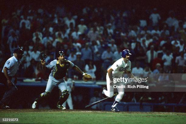 Kirk Gibson of the Los Angeles Dodgers makes a winning home run hit in the bottom of the ninth inning during game one of the 1988 World Series...