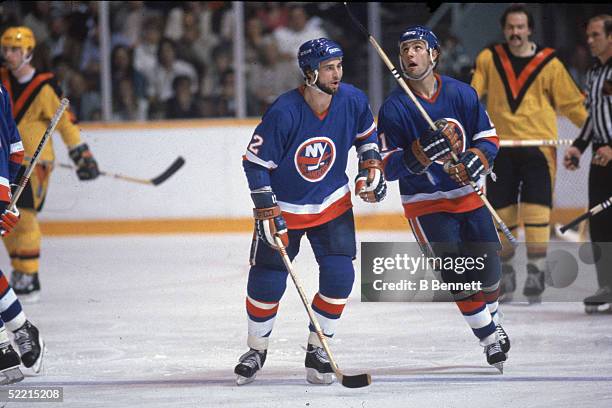 Canadian pro hockey players and brothers Duane and Brent Sutter, of the New York Islanders, skate down the ice during a 1981-82 Stanley Cup finals...