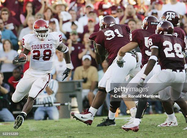 Running back Adrian Peterson of the University of Oklahoma Sooners carries the ball against the Texas A&M University Aggies on November 6, 2004 at...