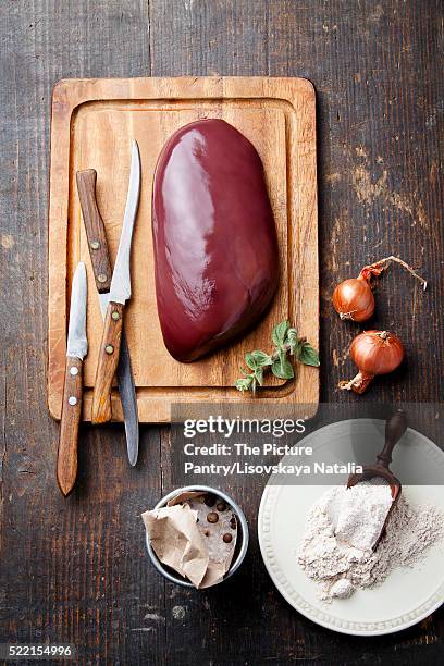raw liver with ingredients on wooden textured table - beef liver stock pictures, royalty-free photos & images