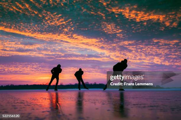 netherlands, loosdrecht, ice skating, sunrise - netherlands sunset stock pictures, royalty-free photos & images