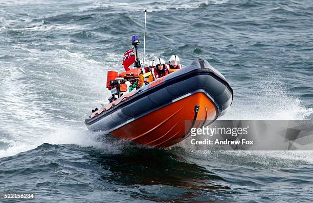 lifeboat crew off coast of wales - rettungsboot stock-fotos und bilder