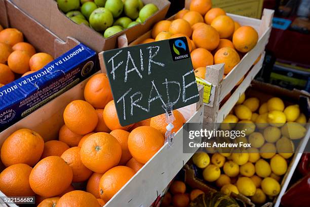 fair trade oranges in store - fairtrade stock pictures, royalty-free photos & images