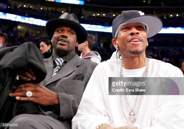 All-Stars Shaquille O'Neal of the Miami Heat and Allen Iverson of the Philadelphia 76ers sit courtside during the got milk? Rookie Challenge, part of...
