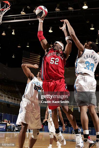 Ernest Brown of the Fayetteville Patriots slams home the basket past Terrence Shannon of the Asheville Altitude during the NBDL game on February 18,...