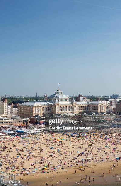 scheveningen, people sunbathing and kurhaus hotel - the hague summer stock pictures, royalty-free photos & images