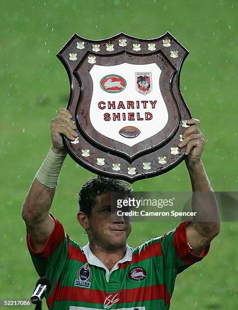 Bryan Fletcher holds up the trophy after winning the NRL Charity Shield match between the South Sydney Rabbitohs and the St George Illawarra Dragons...