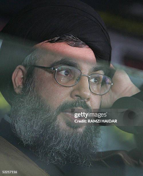 Hassan Nasrallah, the secretary general of Lebanon's militant Shiite Muslim group Hezbollah, addresses from behind a screen of bullit-proof glass...