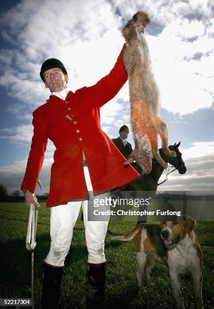 Member The South Durham Hunt shows off a fox which was shot after being flushed out by two blood hounds on the first day of the enforcement of the...